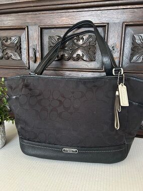 COACH Park Signature Carrie Tote
Handbag.